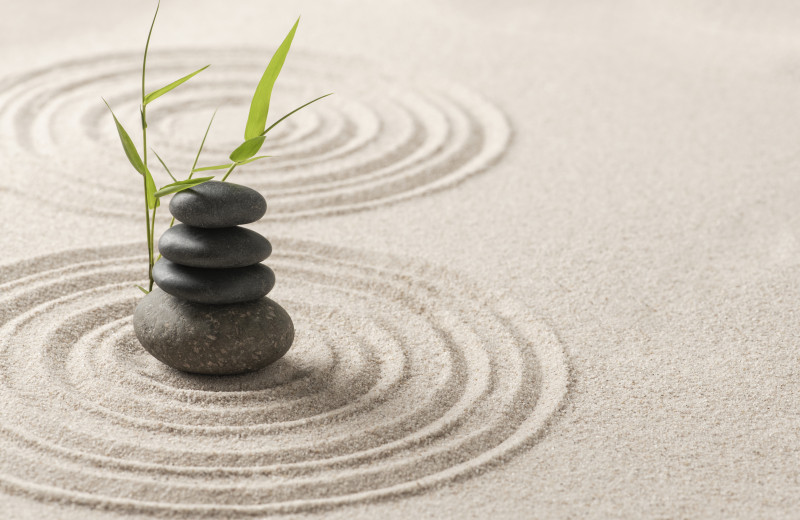 stacked zen stones sand background art balance concept