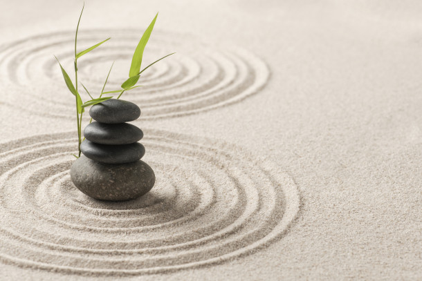 stacked zen stones sand background art balance concept